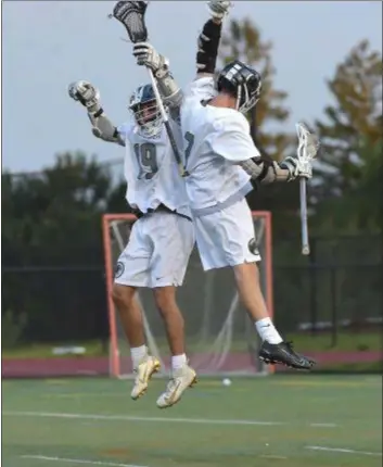  ?? PETE BANNAN – MEDIANEWS GROUP ?? Strath Haven’s Nicky Palermo, left, and Wade Mutz celebrate a Panthers goal which at the time gave them a 3-1 lead over Marple Newtown Wednesday.