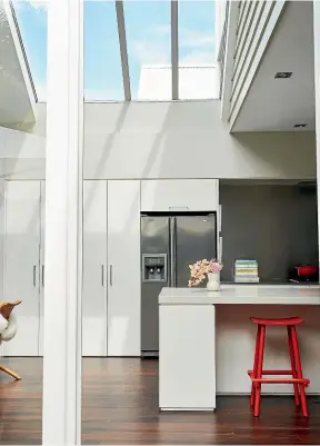  ??  ?? Left: Natural light floods the kitchen area. Right: Karen Walker says her home is chic and eccentric.