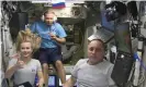  ?? ?? Yulia Peresild, left, film director Klim Shipenko, center, and cosmonaut Anton Shkaplerov speak aboard the ISS. Photograph: AP