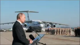  ?? MIKHAIL KLIMENTYEV — POOL PHOTO VIA AP, FILE ?? In this file photo taken on Tuesday, Russian President Vladimir Putin addresses the troops at the Hemeimeem air base in Syria.