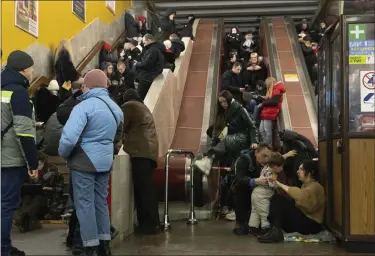  ?? EFREM LUKATSKY — THE ASSOCIATED PRESS ?? People gather in a subway station being used as a bomb shelter during a Russian rocket attack in Kyiv, Ukraine, on Friday.