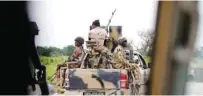  ?? - Reuters file photo ?? PATROLLING: In Nigeria, grave internal security challenges are arising from a resurgence of the militant group Boko Haram, an upsurge in kidnapping­s throughout the country.