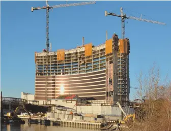  ?? STAFF PHOTO BY CHRIS CHRISTO ?? EVERETT ACTION: Even as constructi­on continues on the Wynn Boston Harbor Casino project, above, CEO Steve Wynn resigned yesterday in wake of sex-harass claims.