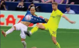  ?? ?? No penalty: Ajer grabs Richarliso­n’s shirt in the box
SKY SPORTS