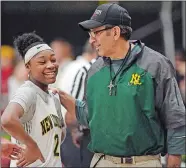  ?? SEAN D. ELLIOT/THE DAY ?? New London girls’ basketball coach David Kohn, right, talks to Jayden Burns as the team takes the floor for the second half in a game against NFA on Jan. 4.