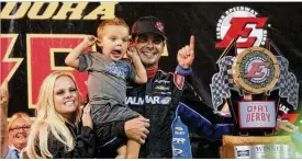  ?? GREG BILLING / CONTRIBUTE­D ?? Stewart Friesen celebrates his Dirt Derby victory with his family at Eldora Speedway on Thursday. He led the final 54 laps for his first win in the NASCAR Gander Outdoors Truck Series.