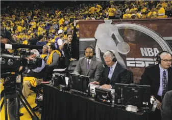  ?? Carlos Avila Gonzalez / The Chronicle ?? An ESPN broadcast team, including former Warriors coach Mark Jackson (left) and play-by-play announcer Mike Breen, calls Game 2 of the Golden State-Utah series Thursday.