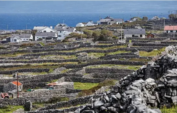  ?? Andy Haslam / New York Times ?? The view from the road to Synge's Chair, a perch of limestone frequented by the Irish playwright J.M. Synge in his day.