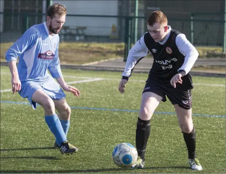  ??  ?? Kevin Gallagher of Gurteen Celtic and Real Tubber’s Matthew Mulhern in action on Sunday. Pic: Donal Hackett.