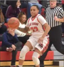  ?? DIGITAL FIRST MEDIA FILE ?? Chester Charter School for the Arts’ Logan Handy, in action against Chichester earlier this season, scored 48 points Friday to go over 2,000 points for her career.