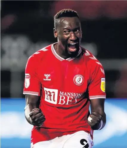  ?? Picture: Rogan Thomson ?? Famara Diedhiou celebrates scoring Bristol City’s second goal in the win against Wycombe