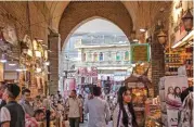  ?? (AFP) ?? People gather at a market in Arbil, the capital of the autonomous Kurdish region of northern Iraq, on May 16