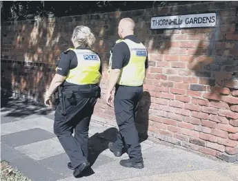  ??  ?? Police officers on Thornhill Gardens, Sunderland.