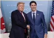  ?? — AP ?? In this file photo, Canada’s Prime Minister Justin Trudeau meets with US President Donald Trump at the G7 leaders summit in La Malbaie, Quebec.