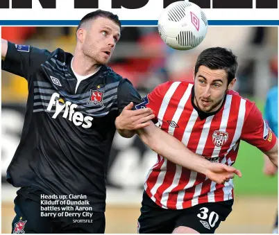  ?? SPORTSFILE ?? Heads up: Ciarán Kilduff of Dundalk battles with Aaron Barry of Derry City