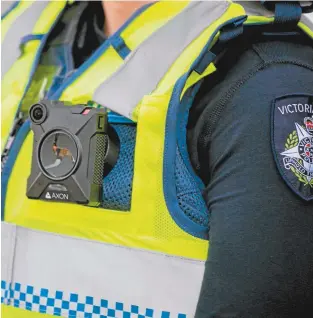  ??  ?? A Victoria Police officer fitted with an Axon body camera.