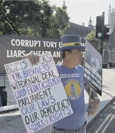  ?? PICTURER: FRANK AUGSTEIN/AP ?? 0 Protesters gathered outside parliament to attack the new bill