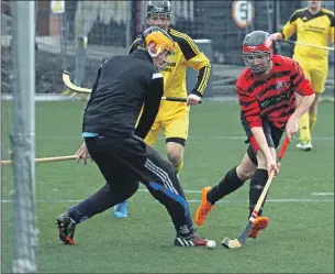  ?? Photograph: Kevin McGlynn. ?? Inveraray goalkeeper Scott MacLachlan makes a save from Oban Camanachd’s Daniel MacVicar during the pre-season friendly at Oban’s community 3G pitch last Saturday.