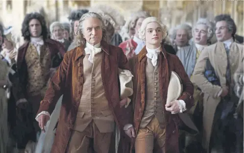  ?? RÉMY GRANDROQUE­S/APPLE TV+ ?? Michael Douglas as Benjamin Franklin and Noah Jupe as Temple Franklin in new drama Franklin