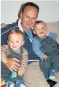  ??  ?? HOUSE OF SORROW: Gary Clarence with his twin boys at their home in New Malden, right, where well-wishers have been leaving flowers, fluffy toys and cards following the deaths of the children