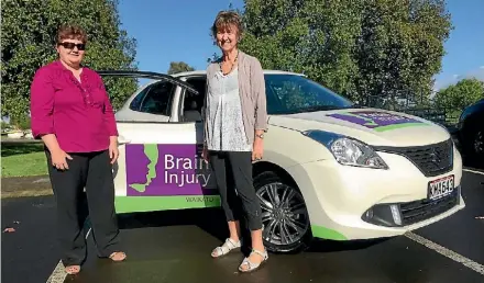  ?? SUPPLIED ?? Ella Scheepers and Marion Baird from Brain Injury Waikato with their new car sponsored by Nicholson Auto Morrinsvil­le and Suzuki New Zealand.