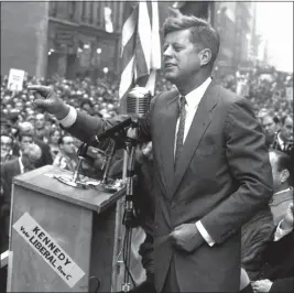  ?? NAT FEIN — THE NEW YORK TIMES ?? John F. Kennedy, then a Democratic candidate for president, delivers a campaign speech during a street rally on Seventh Avenue in Manhattan in 1960. Promising a new chapter has been a recurrent, and often decisive, theme of American campaigns at least since a youthful Kennedy was elected to the White House in 1960.