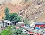  ?? HT PHOTO ?? Landslides, triggered by heavy rains, in Ramsoo and Magarkote areas of Ramban district, had completely blocked vehicular movement on the highway since Saturday morning.