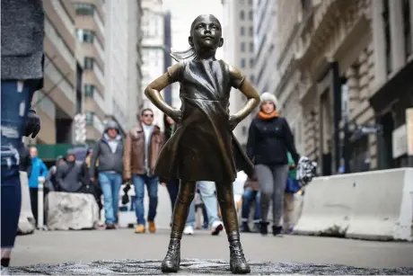  ?? (Brendan McDermid/Reuters) ?? THE ‘FEARLESS GIRLS’ statue is seen on Broadway in the Financial District of Manhattan earlier this year.