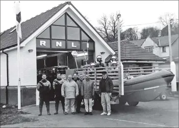  ?? 01_B02twe01 ?? The Arran RNLI crew standing proudly in front of their new station and vessel.