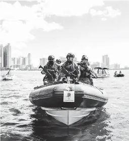  ??  ?? SECURITY CHECK -- Members of the Philippine Coast Guard patrol the waters near the Quirino Grandstand in Manila on Tuesday as part of the security measures for the procession of the Black Nazarene today. (Czar Dancel)