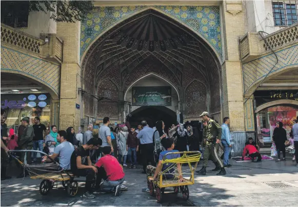  ?? Bloomberg ?? Traders and visitors at the Grand Bazaar in Tehran. Brian Hook, the US special representa­tive for Iran, says ‘the Iranian people face very real economic pressures caused by their government’s corruption, mismanagem­ent and deep investment in terrorism and foreign conflicts’