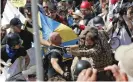  ?? Photograph: Steve Helber/AP ?? White nationalis­t demonstrat­ors clash with counterpro­testers on 12 August 2017 in Charlottes­ville.