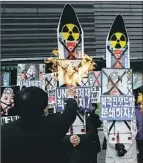  ?? — Photo by the Associated Press ?? South Korean protesters in Seoul burn the pictures of North Korean leader Kim Jong Un during an antiNorth Korea rally following a nuclear test conducted by North Korea Tuesday.