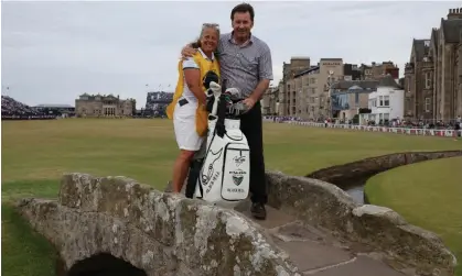  ?? ?? Sir Nick Faldo poses with his caddy, Fanny Sunesson, on the Swilcan Bridge before the 150th Open Championsh­ip last year. Photograph: Paul Childs/Reuters