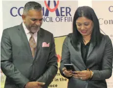  ?? Photo: ?? Minister for Commerce, Trade, Tourism and Transport Faiyaz Koya (left), and Consumer Council of Fiji chief executive officer Seema Shandil during the launch of the mobile app at the Consumer Council of Fiji office in Suva on July 24, 2020.