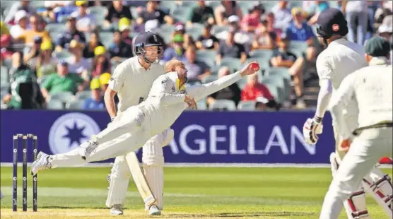  ?? AFP ?? Nathan Lyon catches a screamer to dismiss England’s Moeen Ali in Adelaide on Monday.