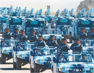  ?? Xinhua-Yonhap ?? This photo shows troops during a military parade at Zhurihe training base in China’s Inner Mongolia Autonomous Region, Sunday. China kicked off a grand military parade to mark the 90th founding anniversar­y of the People’s Liberation Army.