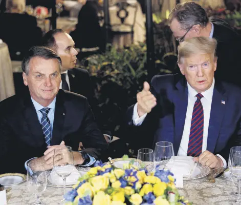  ??  ?? U.S. President Donald Trump hosts a working dinner with Brazilian President Jair Bolsonaro at the Mar-a-Lago resort, Palm Beach, Florida, U.S., March 7, 2020.
