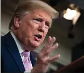  ?? Getty Images/tns ?? U.S. President Donald Trump answers questions in the press briefing room with members of the White House Coronaviru­s Task Force on April 4.