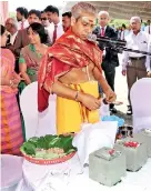  ??  ?? Hindu priest performing the pooja