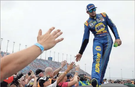  ?? File, Nam Y. Huh / The Associated Press ?? Chase Elliott greets fans before Sunday’s NASCAR Cup Monster Energy Series race at Chicagolan­d Speedway in Joliet, Ill.