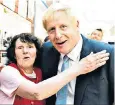  ??  ?? Boris Johnson with Nadine Garlett, 80, at a school in Highbridge, Somerset