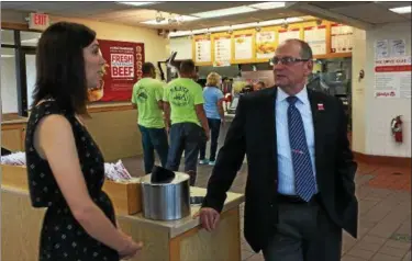  ?? CAROL HARPER — THE MORNING JOURNAL ?? Wendy’s Muy Hamburgers Area Director Randy Writz, 64, Concord Township, right, operates 84 restaurant­s in Northeast Ohio, Pennsylvan­ia and New York. After beating mantel cell lymphoma, a rare blood cancer, Writz volunteere­d for fundraiser­s for the Leukemia &amp; Lymphoma Society. In about three weeks, his restaurant­s raised $79,647 for a Light the Night Walk 5 to 9 p.m. Oct. 8, at Wade Oval in Cleveland, where more than 10,000 participan­ts are expected, said Maggie Smith, left, campaign specialist for Light the Night.