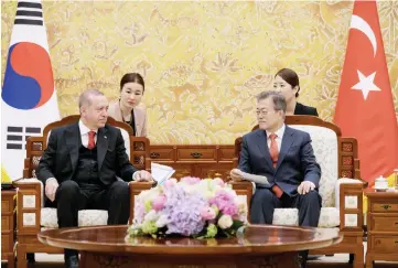  ??  ?? Turkey’s President Recep Tayyip Erdogan sits with South Korea’s President Moon Jae-in during a meeting at the presidenti­al Blue House in Seoul, South Korea. —Reuters photo