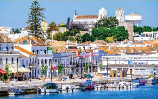  ??  ?? Gear up: The laidback town of Tavira, on the River Gilao, is the first stop on the cycling tour and an ideal spot to eat fish