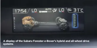  ??  ?? A display of the Subaru Forester e-Boxer’s hybrid and all-wheel drive systems