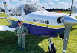  ??  ?? Top gun: Jacob Newson next to plane he flew for a few seconds