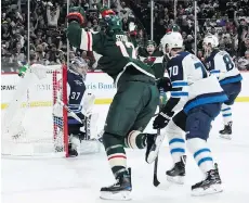  ?? HANNAH FOSLIEN/GETTY IMAGES ?? Minnesota Wild centre Eric Staal celebrates his first goal of the playoffs during the second period of Game 3 against the Winnipeg Jets in St. Paul, Minn., on Sunday.