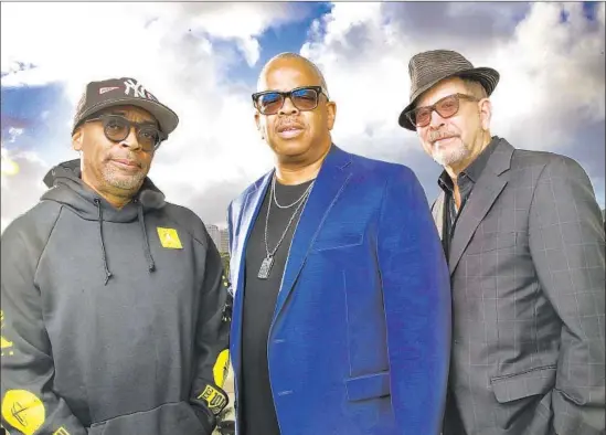  ?? Kirk McKoy Los Angeles Times ?? “IT’S A TEAM,” says Spike Lee, left, with Terence Blanchard and Barry Alexander Brown. All three are Oscar nominees for their work on “BlacKkKlan­sman.”