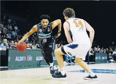  ?? PHOTO: GETTY IMAGES ?? Out of my way . . . Corey Webster, of the New Zealand Breakers, drives against Rob Loe, of the Cairns Taipans, during the round five ANBL match at Spark Arena in Auckland last night.
